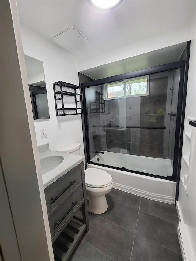 1404 Parr Lake Dr Unit 14D, Newburgh, NY 12550 - full bathroom featuring bath / shower combo with glass door, toilet, tile patterned flooring, and vanity