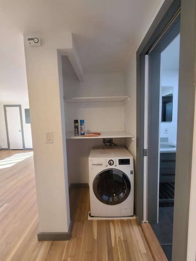 1404 Parr Lake Dr Unit 14D, Newburgh, NY 12550 - washroom featuring washer / dryer, laundry area, and light wood-style flooring