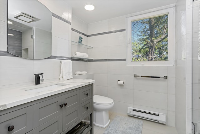18 Shady Glen Ct Unit 302, New Rochelle, NY 10805 - bathroom with baseboard heating, tile patterned flooring, vanity, toilet, and tile walls