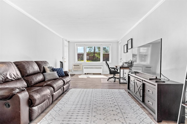 living room featuring light wood finished floors, radiator heating unit, baseboards, a wall unit AC, and ornamental molding