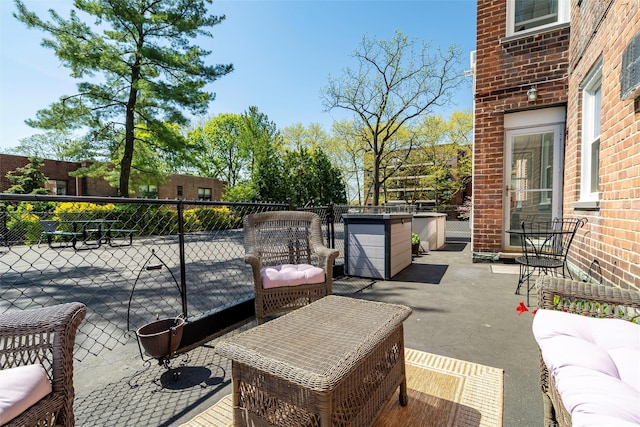 view of patio / terrace featuring fence