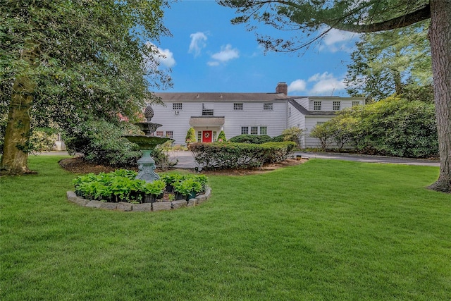 12 W Mall Dr, West Hills, NY 11743 - rear view of house with a chimney and a yard
