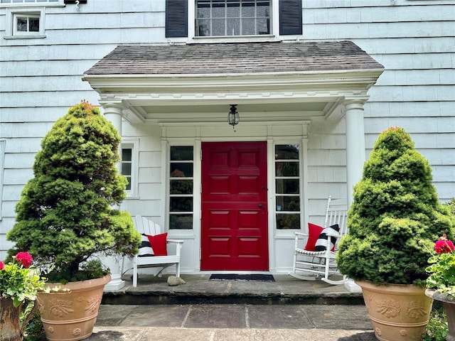 12 W Mall Dr, West Hills, NY 11743 - view of exterior entry featuring roof with shingles
