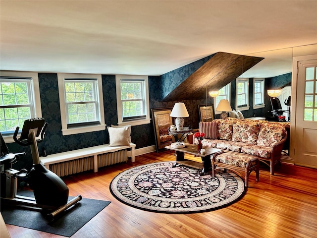 12 W Mall Dr, West Hills, NY 11743 - living area featuring hardwood / wood-style floors, radiator heating unit, and wallpapered walls