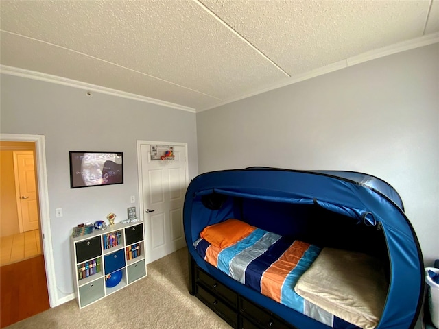 carpeted bedroom with crown molding and a textured ceiling
