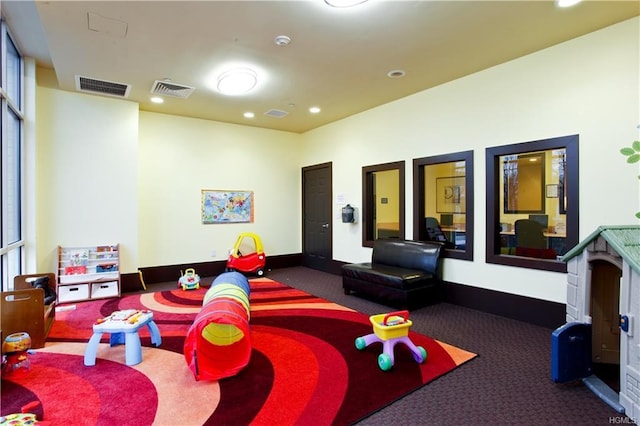 playroom with carpet floors, recessed lighting, baseboards, and visible vents
