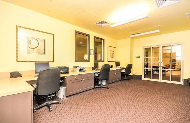 home office featuring light colored carpet and visible vents
