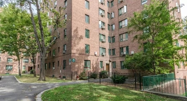 view of building exterior featuring fence