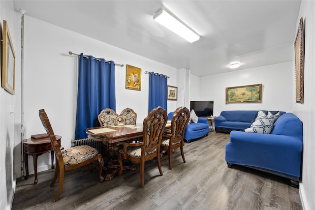 dining area with wood finished floors