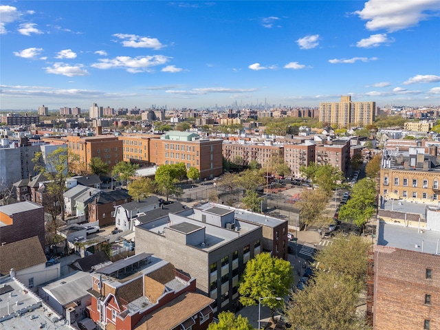 birds eye view of property with a view of city