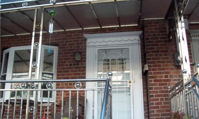 2713 Eastchester Rd, Bronx, NY 10469 - entrance to property with brick siding