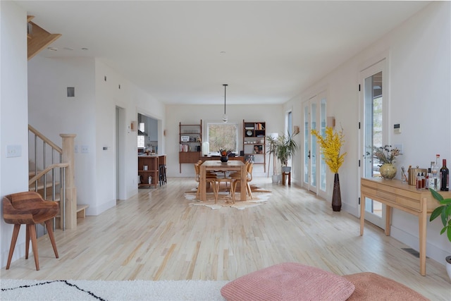 21 Private Way, Garrison, NY 10524 - living area with stairway and light wood-type flooring