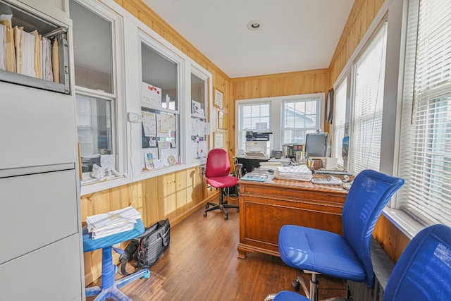 office space with wooden walls and wood finished floors
