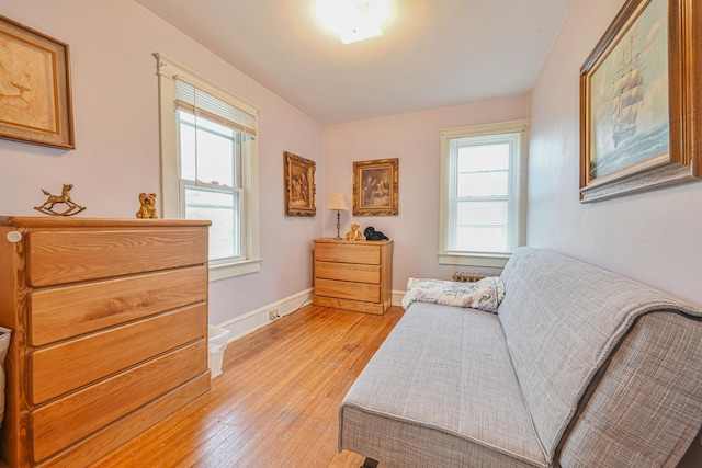 sitting room with light wood-type flooring and baseboards