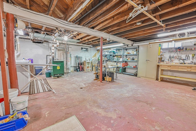 unfinished below grade area with gas water heater, a workshop area, and a heating unit