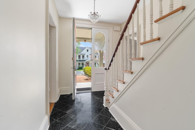 64 Paulding Ave, Cold Spring, NY 10516 - entryway featuring stairs, baseboards, a chandelier, and granite finish floor