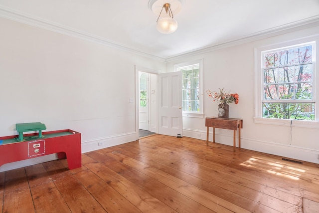 64 Paulding Ave, Cold Spring, NY 10516 - entryway featuring visible vents, baseboards, crown molding, and hardwood / wood-style floors
