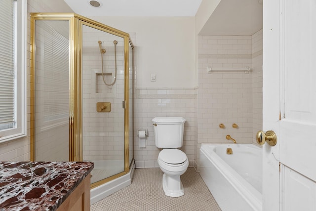 64 Paulding Ave, Cold Spring, NY 10516 - full bathroom with toilet, tile patterned floors, tile walls, and a tile shower