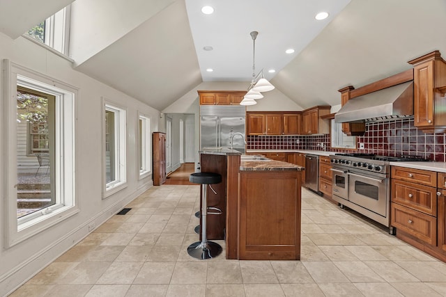 64 Paulding Ave, Cold Spring, NY 10516 - kitchen with brown cabinetry, a sink, high end appliances, and wall chimney range hood