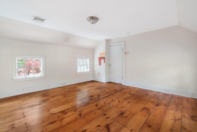 64 Paulding Ave, Cold Spring, NY 10516 - empty room featuring wood-type flooring, baseboards, vaulted ceiling, and visible vents