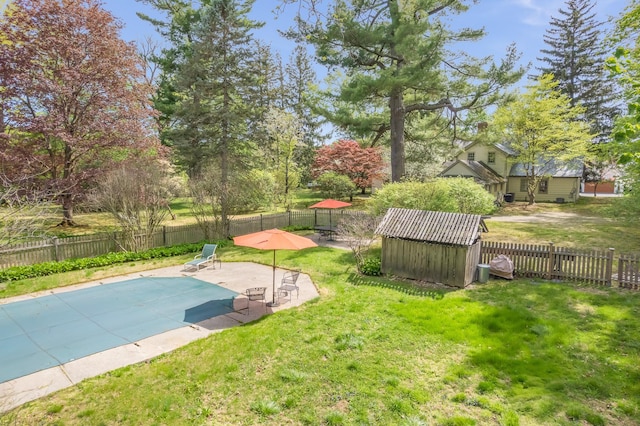 64 Paulding Ave, Cold Spring, NY 10516 - view of swimming pool with a fenced backyard, a storage unit, a yard, and a patio area