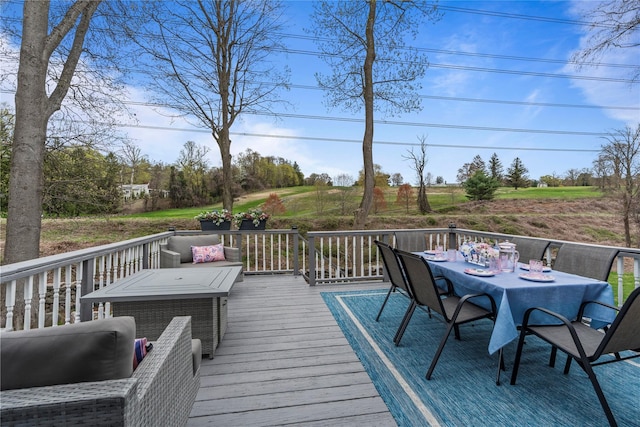 wooden terrace with outdoor dining area