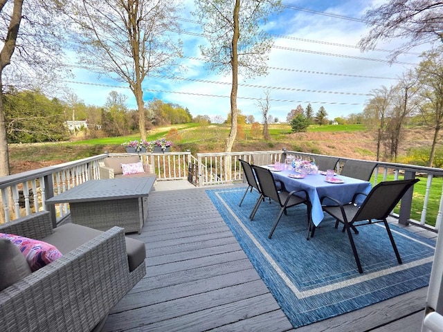deck with outdoor dining area
