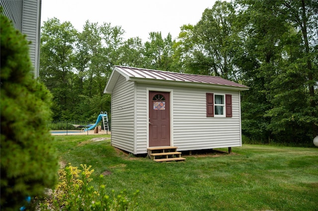 822 W Kaisertown Rd, Montgomery, NY 12549 - view of outbuilding with fence, a fenced in pool, an outdoor structure, and entry steps