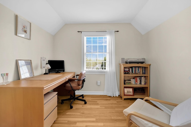 office with lofted ceiling, light wood finished floors, and baseboards