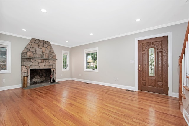 37 Myrtle Blvd, Larchmont, NY 10538 - unfurnished living room with a stone fireplace, stairway, light wood finished floors, crown molding, and recessed lighting