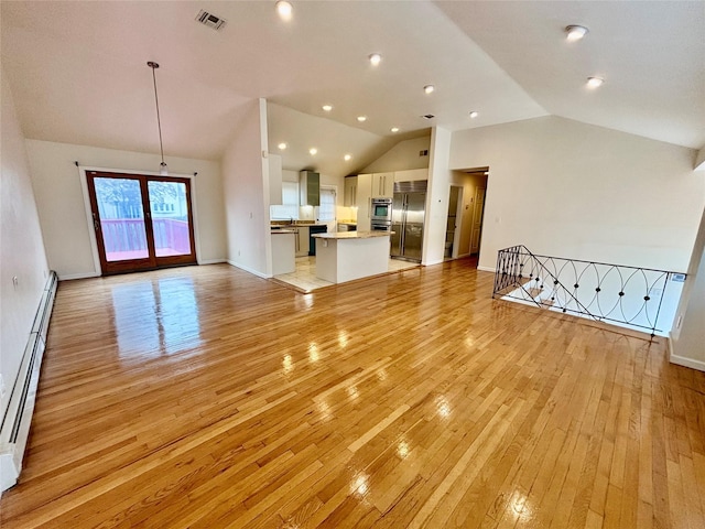 5 Elm St, Great Neck, NY 11021 - unfurnished living room featuring baseboard heating, light wood-style floors, baseboards, lofted ceiling, and visible vents