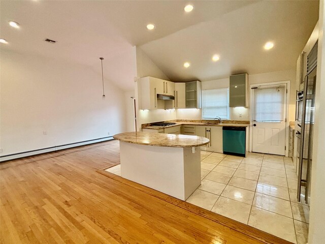 5 Elm St, Great Neck, NY 11021 - kitchen with baseboard heating, lofted ceiling, gas stovetop, under cabinet range hood, and dishwashing machine