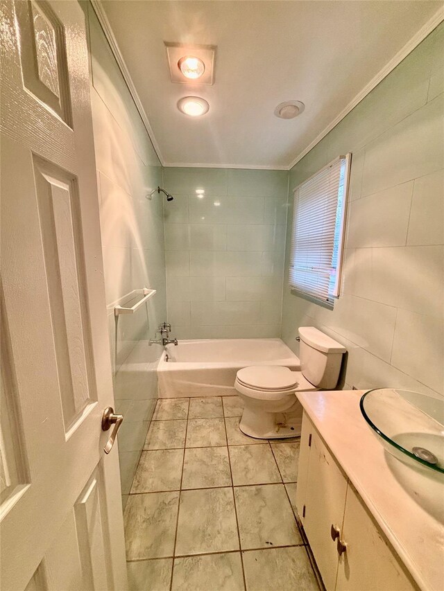 5 Elm St, Great Neck, NY 11021 - full bath featuring crown molding, tile patterned flooring, vanity, toilet, and bathing tub / shower combination