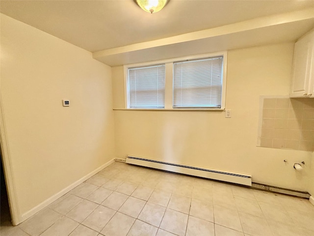 5 Elm St, Great Neck, NY 11021 - unfurnished room featuring light tile patterned floors, baseboards, and baseboard heating