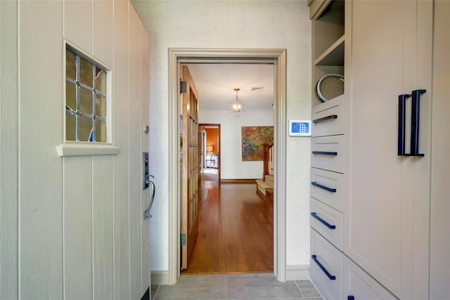 10 Maple Hill Dr, Larchmont, NY 10538 - hallway featuring baseboards and a chandelier