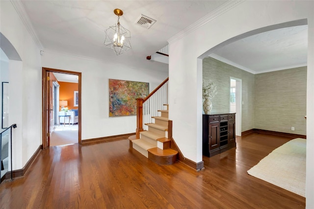10 Maple Hill Dr, Larchmont, NY 10538 - entrance foyer with dark wood-style floors, baseboards, arched walkways, and crown molding