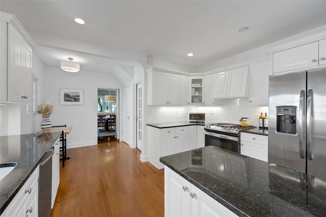 10 Maple Hill Dr, Larchmont, NY 10538 - kitchen with stainless steel appliances, custom exhaust hood, white cabinets, wood finished floors, and recessed lighting