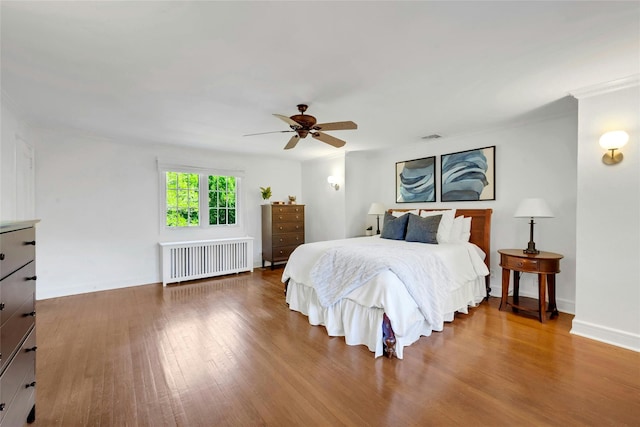 10 Maple Hill Dr, Larchmont, NY 10538 - bedroom with radiator, wood finished floors, and ceiling fan