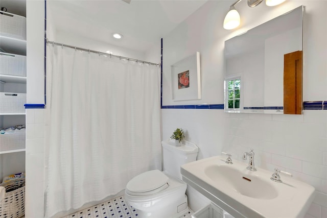 10 Maple Hill Dr, Larchmont, NY 10538 - bathroom featuring tile walls, a sink, toilet, curtained shower, and a wainscoted wall