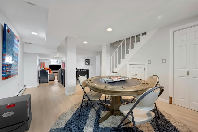 10 Maple Hill Dr, Larchmont, NY 10538 - dining space with light wood finished floors, stairs, baseboards, and recessed lighting