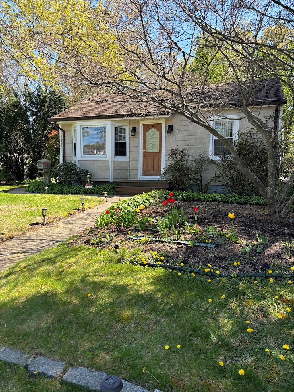 26 Weichers St N, Ronkonkoma, NY 11779 - single story home with a front yard