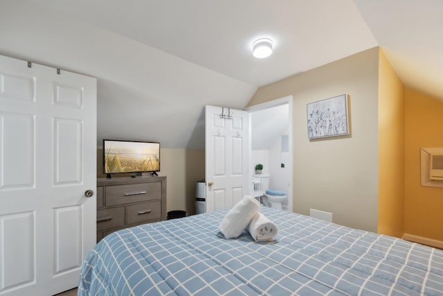 bedroom featuring lofted ceiling