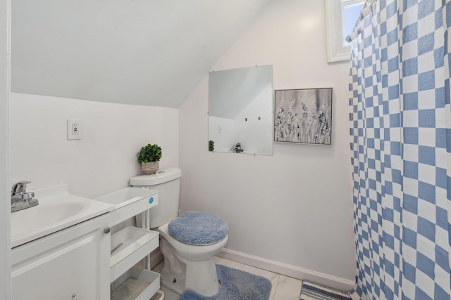 full bathroom featuring vanity, toilet, tile patterned flooring, and vaulted ceiling