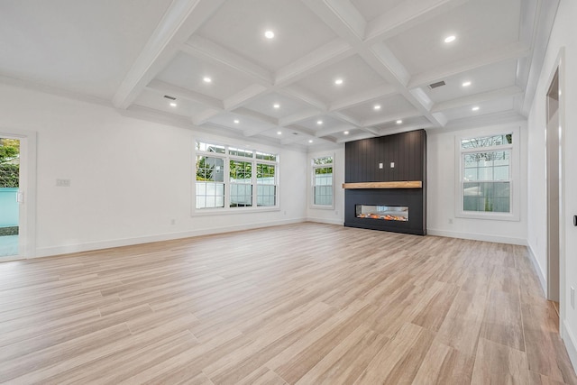 unfurnished living room with baseboards, a wealth of natural light, and coffered ceiling