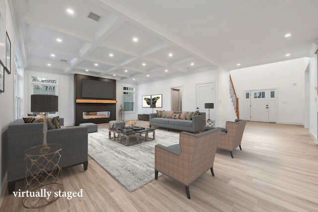 living room featuring recessed lighting, light wood-style flooring, coffered ceiling, and beam ceiling