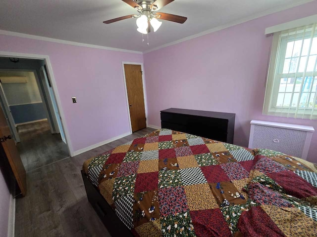 bedroom with radiator, baseboards, ornamental molding, wood finished floors, and a ceiling fan