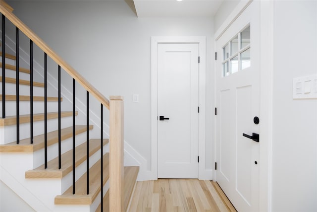 interior space featuring stairway and wood finished floors