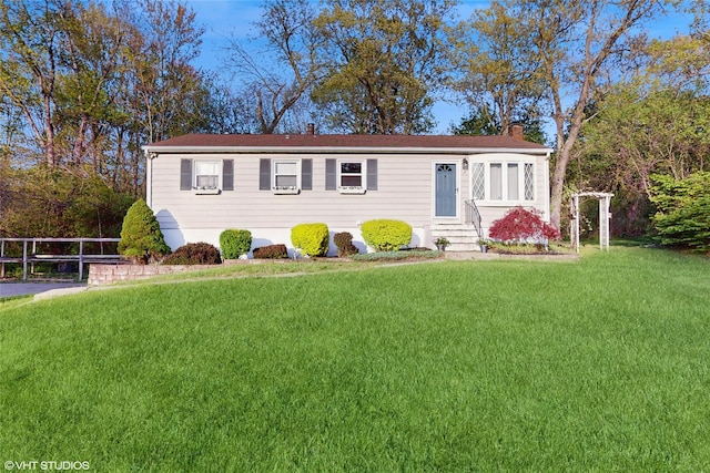 17 Fenmore Dr, Wappingers Falls, NY 12590 - view of front facade featuring a front yard, a chimney, and entry steps