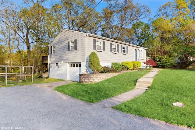 17 Fenmore Dr, Wappingers Falls, NY 12590 - view of front of house featuring driveway, a front yard, and a garage