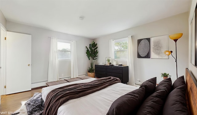 17 Fenmore Dr, Wappingers Falls, NY 12590 - bedroom featuring a baseboard radiator and wood finished floors